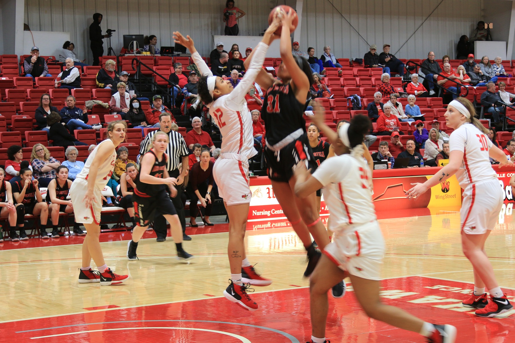 Faith Simpson's Double Double Helps Power Red Raven Women's Basketball over Red Devils
